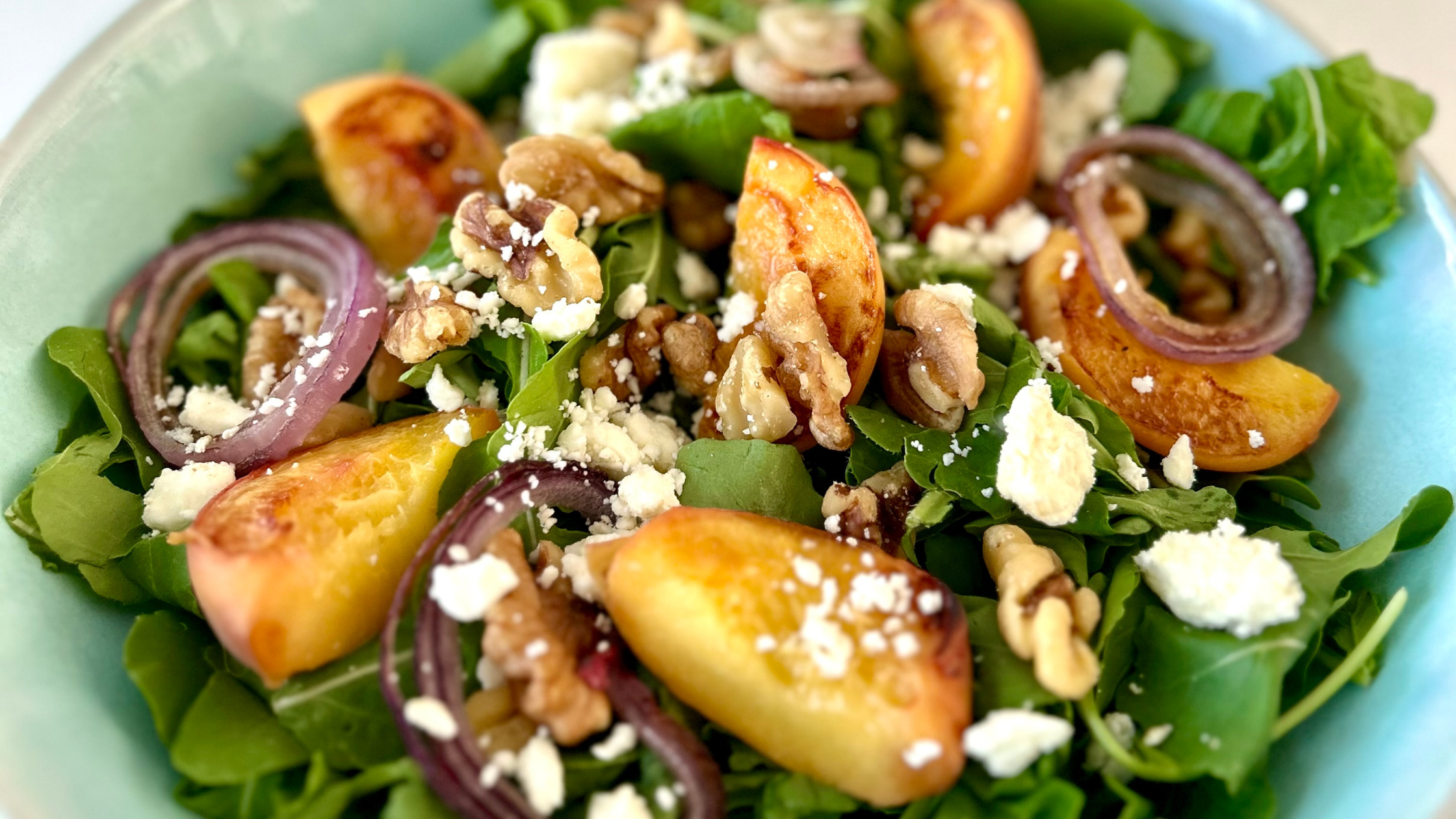 grilled peach and arugula salad